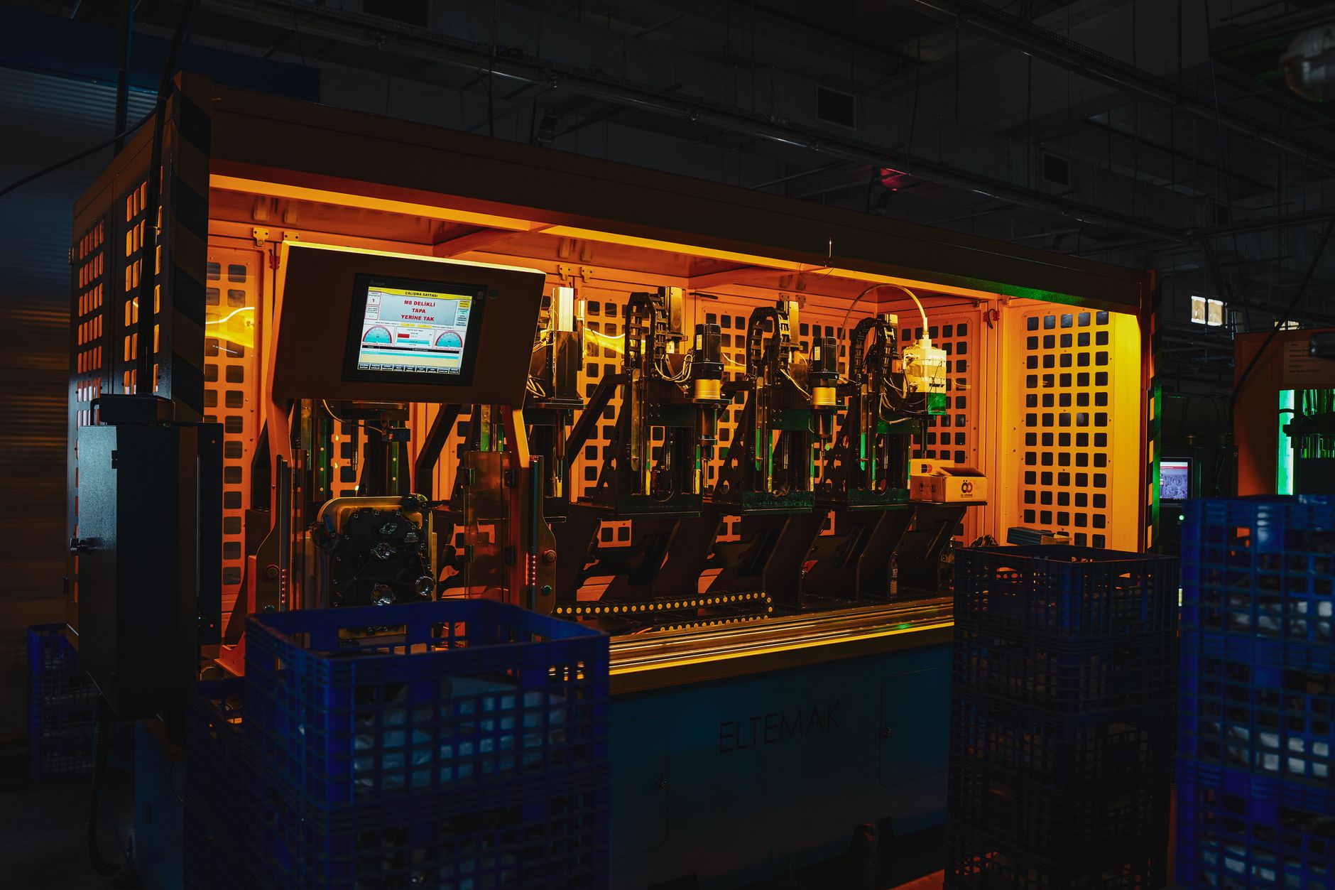 Complex industrial machinery with interlocking parts, evoking a chain of automated triggers