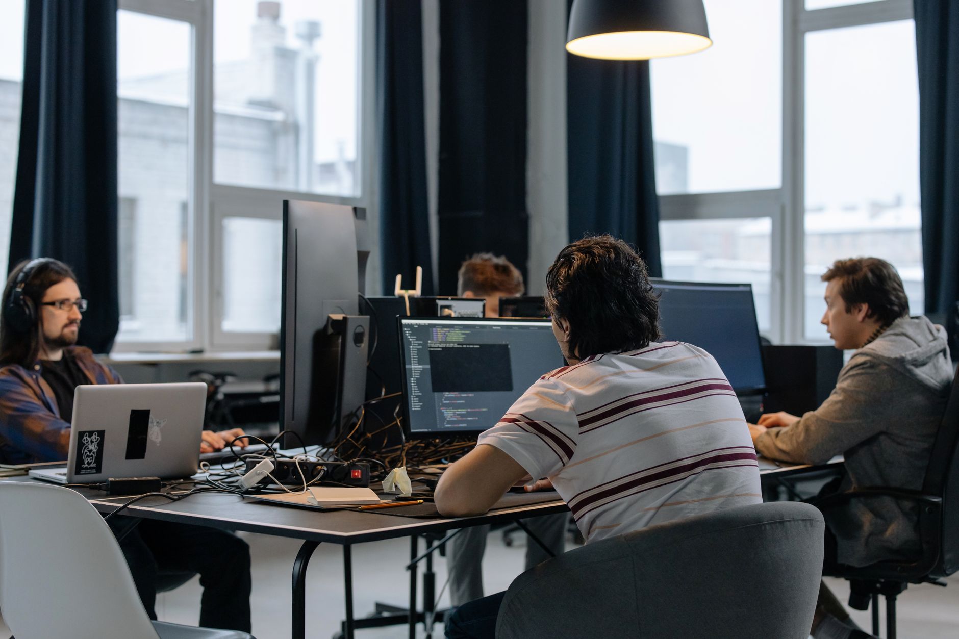 Small team of developers working at computers in an office